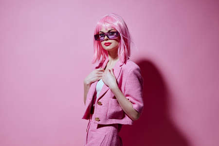 Beautiful fashionable girl bright makeup pink hair glamor stylish glasses unalteredの写真素材