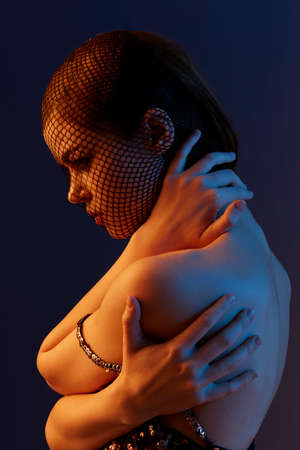 attractive woman black veil posing eye-catching glamor unalteredの写真素材