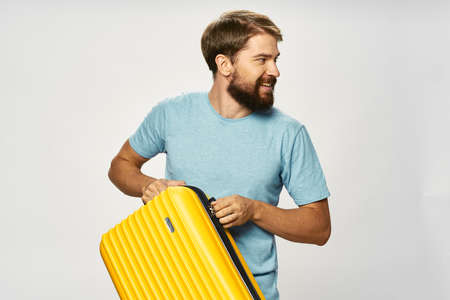 man with yellow suitcase travel luggage passenger airport