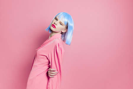 glamorous woman in blue wig pink dress red lips isolated backgroundの写真素材