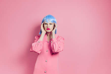portrait of a woman wears a blue wig makeup isolated backgroundの写真素材