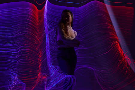 Portrait of a charming lady disco neon lines luxury fashion color background unaltered