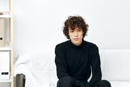 man laptop sitting on white sofa online training communicationの写真素材