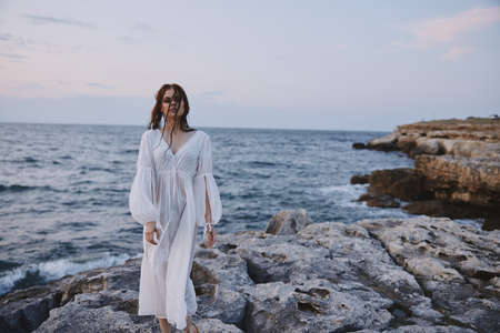 pretty woman in white dress and travel lifestyle landscape stonesの写真素材