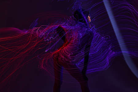 Portrait of a charming lady neon lines light posing color background unaltered