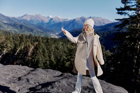 tourist standing on the top of the mountain landscape mountain forest relaxation