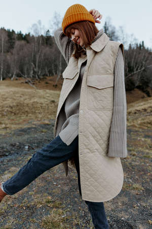 woman in the autumn forest walk fresh air travel landscapeの写真素材