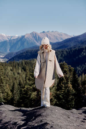 tourist fashion glasses mountain top nature freedom landscapeの写真素材