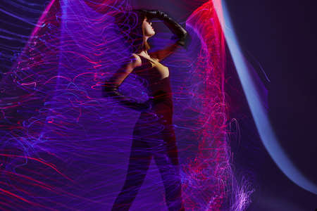 Portrait of a charming lady disco neon lines luxury fashion Lifestyle unalteredの写真素材