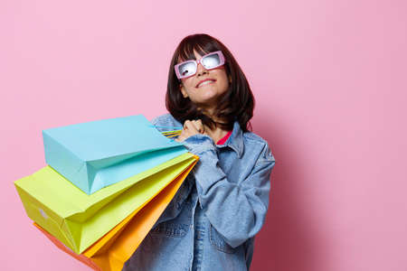 portrait woman holding colorful bags shopping Lifestyle fashionの写真素材