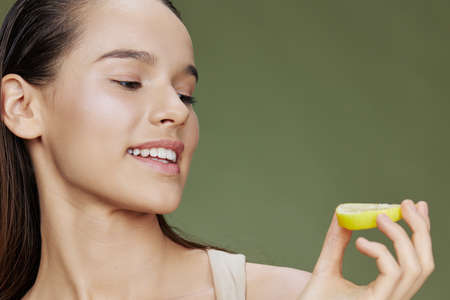 young woman lemon vitamins health cosmetology close-up Lifestyleの写真素材