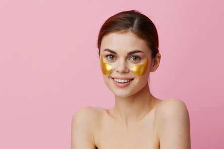 beautiful woman golden patches on the face close-up Lifestyle
