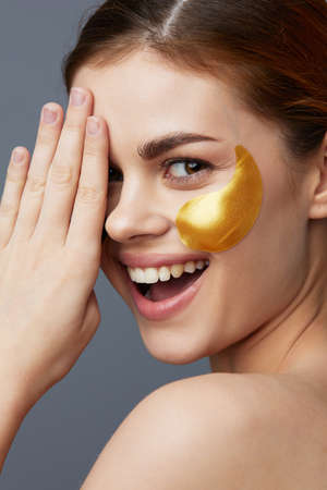 portrait woman multicolored patches rejuvenation skin care fun gray background