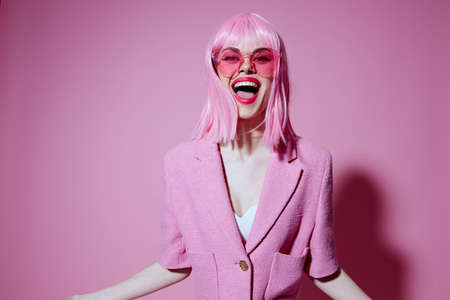 Pretty young female in pink glasses cosmetics glamor emotions Studio Model unalteredの写真素材