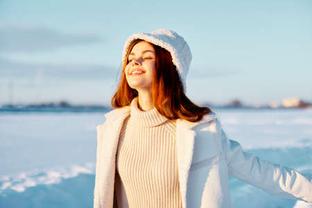 young woman winter clothes walk snow cold vacation Fresh airの写真素材