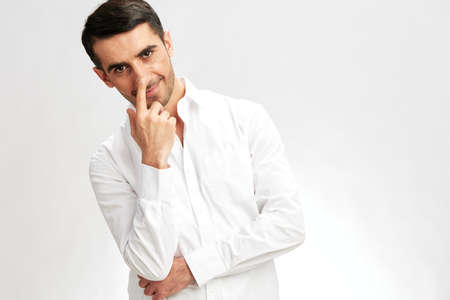 businessman portrait in a white shirt a pensive look self-confidence isolated background