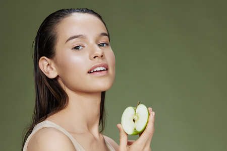 woman happy smile green apple health close-up Lifestyleの写真素材