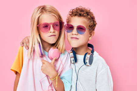 Happy couple child in sunglasses have fun with friends Childhood lifestyle conceptの写真素材