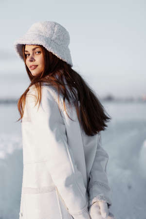 young woman red hair snow field winter clothes travel