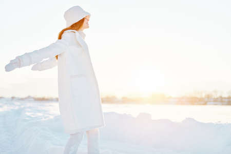 young woman winter weather snow posing nature rest natureの写真素材