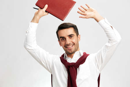 man portrait notepad with pen smile emotions isolated backgroundの写真素材