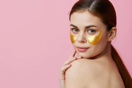 young woman skin care face patches bare shoulders hygiene close-up Lifestyleの写真素材