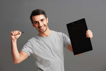 handsome man tablet for paper documents Gray backgroundの写真素材