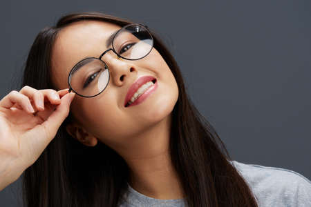 portrait woman in a t-shirt glasses Youth style fun isolated backgroundの写真素材