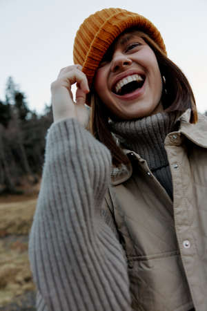 portrait of a woman walk outdoors autumn weather mountains landscapeの写真素材