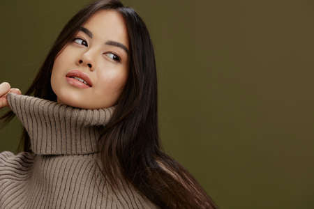 Brunette in a sweater posing smile clothing fashion Lifestyleの写真素材