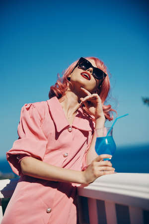 Delighted young girl pink hair sunglasses leisure luxury vintage Summer day