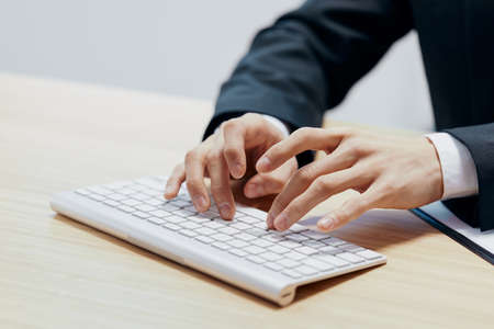 man sitting at a desk in front of a computer emotions Workspace