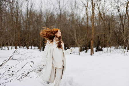 woman Walk in winter field landscape outdoor entertainment There is a lot of snow aroundの写真素材