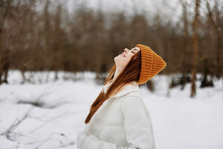 woman red hair walk in the fresh winter air Lifestyleの写真素材