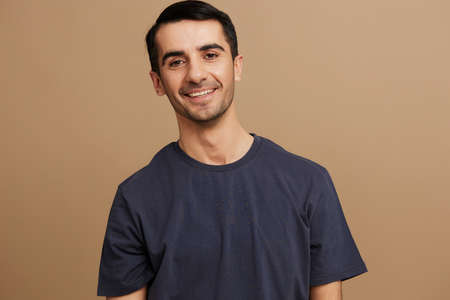 handsome man in gray t-shirts gesture hands smile emotions isolated background
