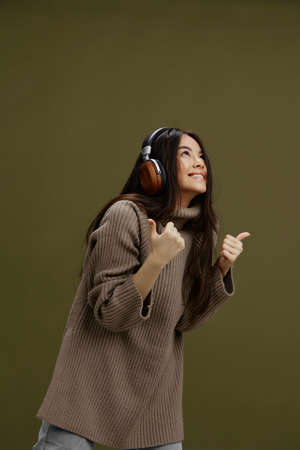 portrait woman in headphones listening to music emotions isolated background