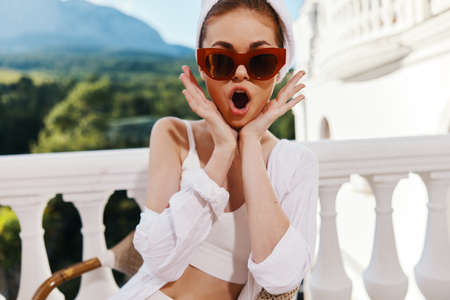 Attractive young woman with towel on head wearing sunglasses Lazy morningの写真素材