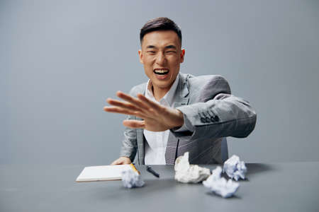 manager fatigue nervous breakdown hard work crumpled paper on the table executiveの写真素材