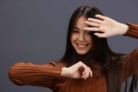 pretty woman fun brown sweater posing casual wear Lifestyle