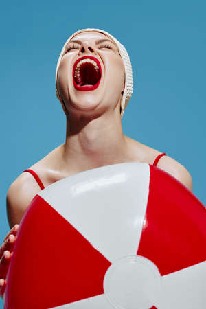 Screaming woman in a red swimsuit with a bathing ball holds her head up and yells. New concept art