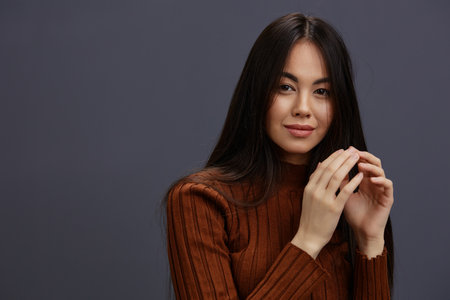 beautiful woman brown sweater glamor posing smile fashion Lifestyleの写真素材
