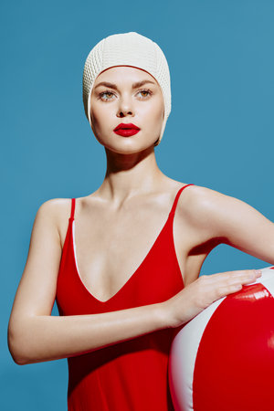 Retro banner in the summer theme of the sea. A confident swimmer in a cap with a striped ball looks awayの写真素材