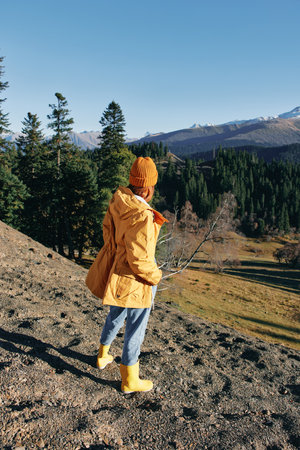 Woman in full height backpacker walking on the mountain looking nature happiness overlooking snowy...