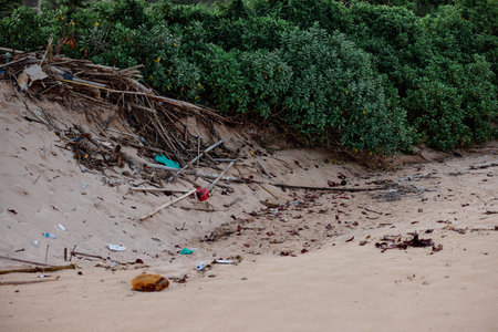Bottles of plastic and garbage on the sand on the beach near the ocean, garbage catastrophe, garbage...