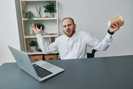 A man in a wheelchair, a businessman with tattoos in the office at a laptop, a coffee break,...