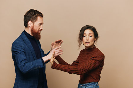 Man and woman couple in a relationship quarrel, yelling, psychological violence in the family, problems in a real relationship between peopleの写真素材