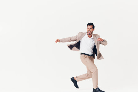 man smiling beige business winner happy white running suit businessman victoryの写真素材