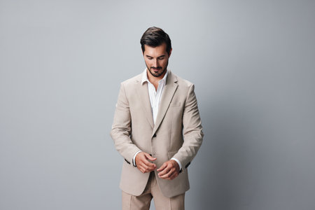 man happy smiling beige suit businessman handsome crossed portrait business copyspaceの写真素材