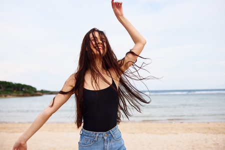 travel woman young beach sea lifestyle sunset summer running flight smileの写真素材