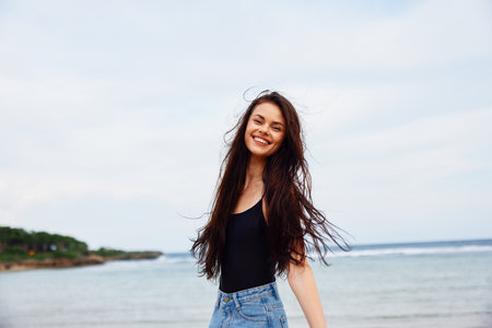 woman lifestyle beach travel running smile happy summer sunset sea youngの写真素材